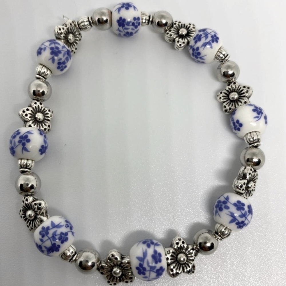 handmade bracelet with silver flower accent